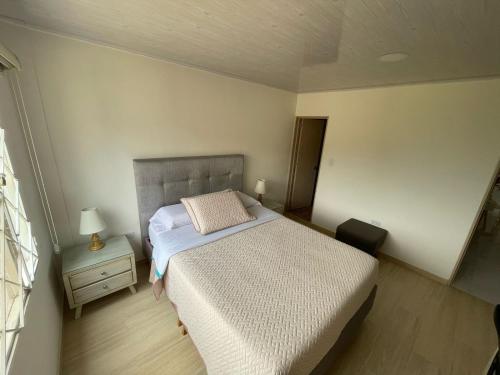 Postel nebo postele na pokoji v ubytování Habitaciónes Casa Holiday Fusa