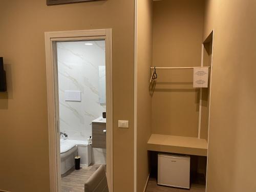 a bathroom with a sink and a toilet and a sink at Exclusive B&B in Reggio Calabria