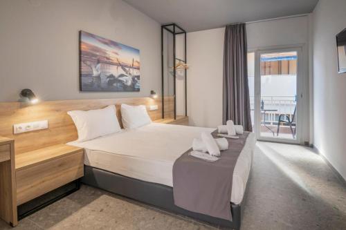 Ένα ή περισσότερα κρεβάτια σε δωμάτιο στο Salty Sea View Apartments