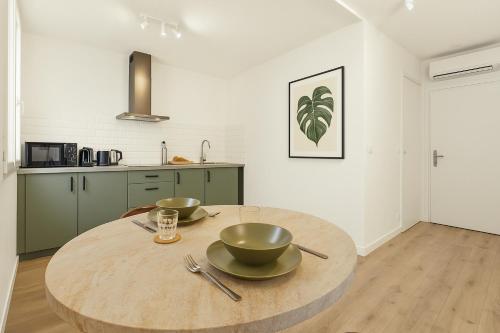 Kuchyňa alebo kuchynka v ubytovaní Appartement proximité Place des Lices avec parking