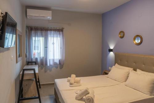 Ένα ή περισσότερα κρεβάτια σε δωμάτιο στο Salty Sea View Apartments