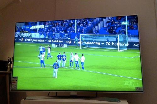 a television screen with a soccer game on it at Sea Apartment in Oslo