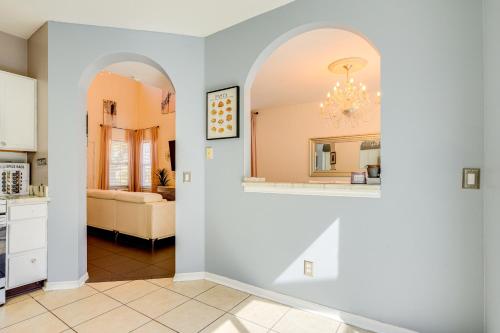 a living room with a kitchen with a chandelier at 9 Mi to Beach Peaceful Riverview Home with Patio in Riverview