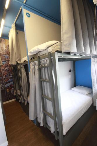 a group of bunk beds in a room at Hostel Distrito 011 in Sao Paulo