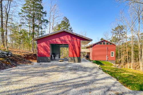 a red barn with a red covering on a road at Cumberland Lake Retreat Furnished Deck and Grill! in Burnside
