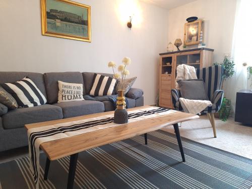 a living room with a couch and a coffee table at Calma di Medulin in Medulin