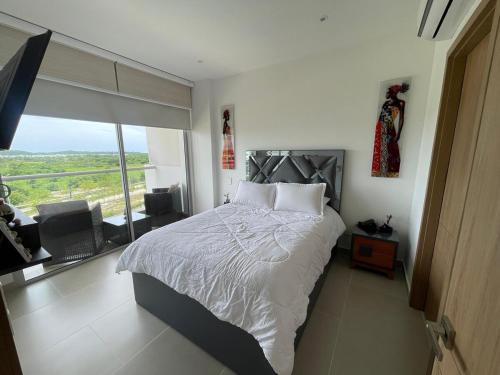 Postel nebo postele na pokoji v ubytování Apartamento con piscina, playa y cerca aeropuerto de Cartagena