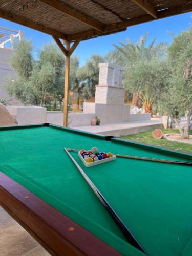 a pool table with a bowl on top of it at Meddur Siwa Oasis in Siwa