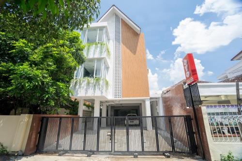 a building with a gate in front of it at Collection O 2627 Ratamya Co-living in Yogyakarta