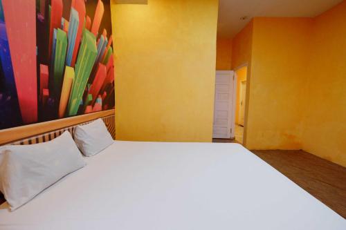 Кровать или кровати в номере Hotel O Homestay Harapan Syariah Bulukumba Near Bulukumba