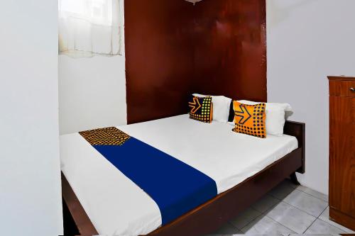 Postel nebo postele na pokoji v ubytování OYO Life 92651 Meir E-homestay Syariah