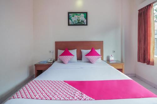 Ένα ή περισσότερα κρεβάτια σε δωμάτιο στο Capital O Galaxy Inn