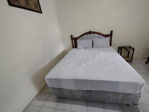 Кровать или кровати в номере Hotel O Wisma Bunda Syariah Near Man Pinrang