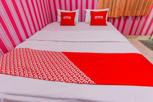 Ein Bett oder Betten in einem Zimmer der Unterkunft Hotel O Budi Residence 1