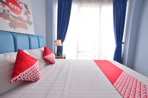 Ένα ή περισσότερα κρεβάτια σε δωμάτιο στο Hotel O Appartel Cempaka