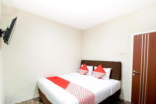 Postel nebo postele na pokoji v ubytování Super OYO Capital O 217 A1 Hotel