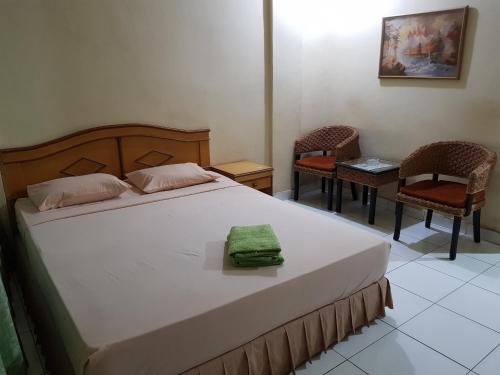 Letto o letti in una camera di Hotel O Istana