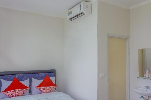 Ένα ή περισσότερα κρεβάτια σε δωμάτιο στο Hotel O 77 Guesthouse