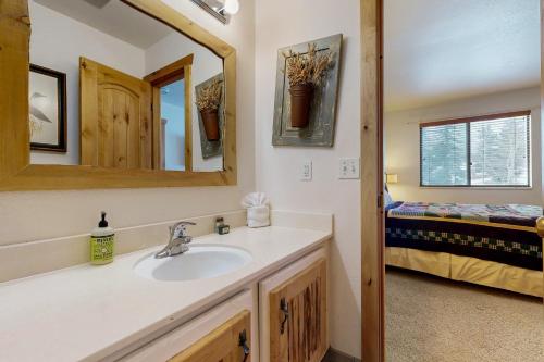 a bathroom with a sink and a mirror at Big Views at Red Pine in Park City