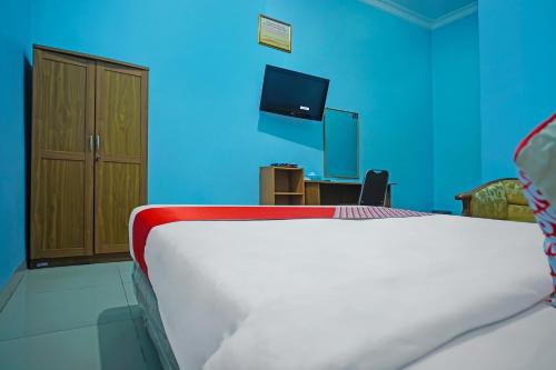 Katil atau katil-katil dalam bilik di Hotel O Sidikalang Near KEJAKSAAN NEGERI DAIRI