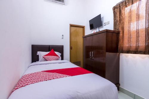 Ένα ή περισσότερα κρεβάτια σε δωμάτιο στο Hotel O Kost Arie 1