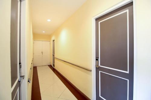 an empty hallway with a door in a house at Capital O 175 K-60 Residence in Surabaya