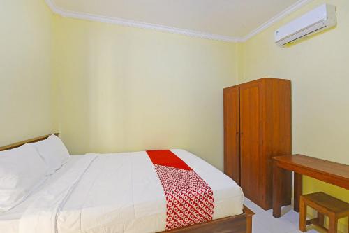 Postel nebo postele na pokoji v ubytování OYO Life 90675 Ld Residence