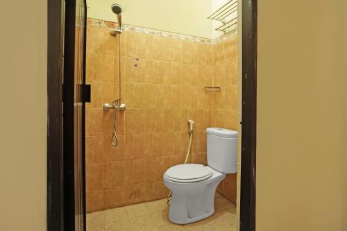 Koupelna v ubytování Hotel O Wisma Empat Lima Syariah