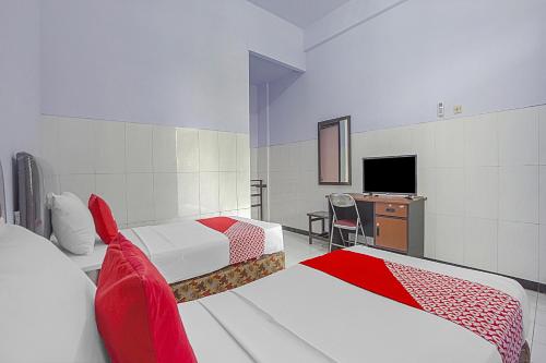 Μια τηλεόραση ή/και κέντρο ψυχαγωγίας στο OYO Life 90589 Palem Garden Hotel