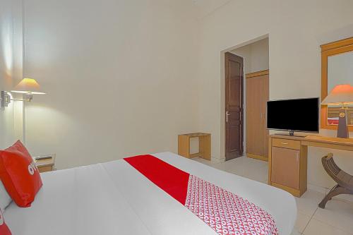 Μια τηλεόραση ή/και κέντρο ψυχαγωγίας στο OYO Life 90589 Palem Garden Hotel