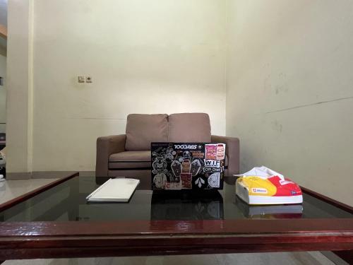 Гостиная зона в Hotel O Azwa Gh Katingan Near Lapangan Sepak Bola Pegatan Hilir
