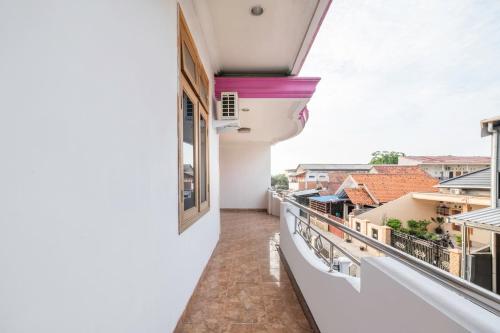 a view from the balcony of a white building at OYO Life 2412 Mandala Residence in Pundong