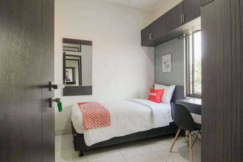 Katil atau katil-katil dalam bilik di OYO 3826 Columbus Residence K11