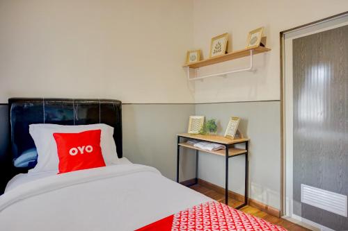 Ένα ή περισσότερα κρεβάτια σε δωμάτιο στο Hotel O Alhesa Residence