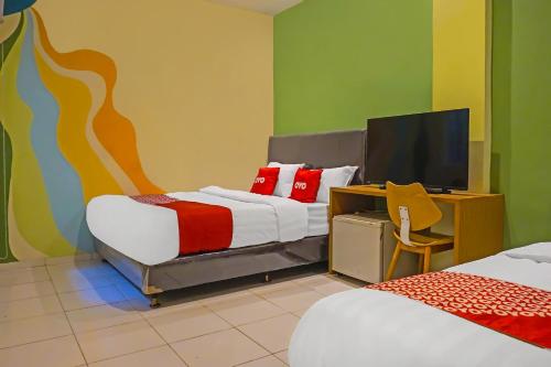 Ένα ή περισσότερα κρεβάτια σε δωμάτιο στο Hotel O Orienchi 3