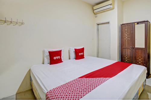 Кровать или кровати в номере Hotel O Garden Homestay 3 Merlion