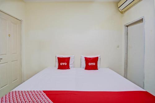 Кровать или кровати в номере Hotel O Garden Homestay 3 Merlion