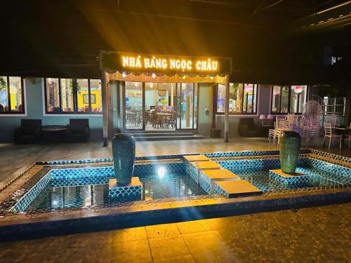 a swimming pool in the middle of a building at Minh Chau Beach Resort in Quang Ninh