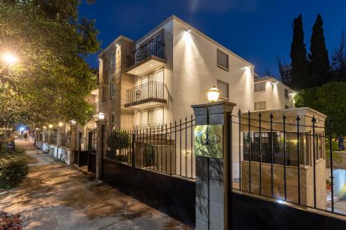a house with a wrought iron fence at night at Suites Obelisk in Mexico City