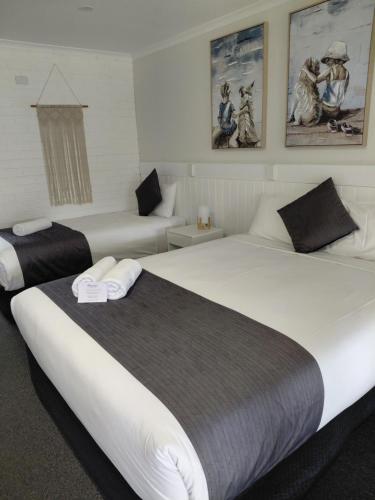 Ένα ή περισσότερα κρεβάτια σε δωμάτιο στο Acacia Motor Inn