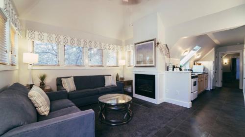 a living room with a couch and a kitchen at Butter milk falls inn in Milton