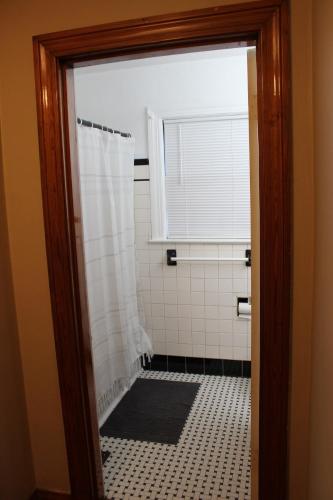a bathroom with a shower and a window at Charming Modern Retreat Near Downtown Jeffersonville & Bob Hedge Park in Jeffersonville