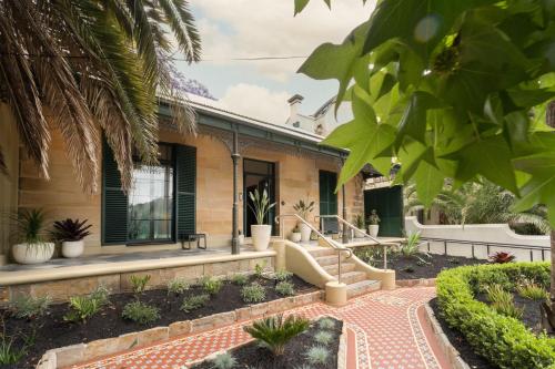a house with a garden in front of it at Little Drifter Surry Hills in Sydney