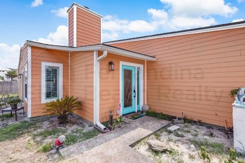 a small house with orange siding at 2706 W, 3rd St home in Fernandina Beach