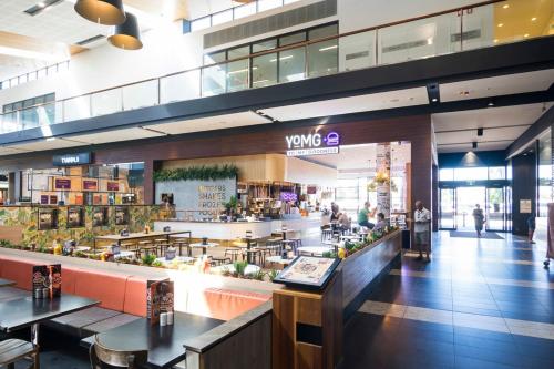 a view of a shopping mall with a vyna store at Spacious Serene Luxury Retreat in Narre Warren South