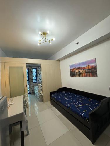 Postel nebo postele na pokoji v ubytování Sea Residences JEREMIAH2911