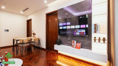 a room with a wall with a large screen at Thuý Doji Diamond Apartment in Hai Phong