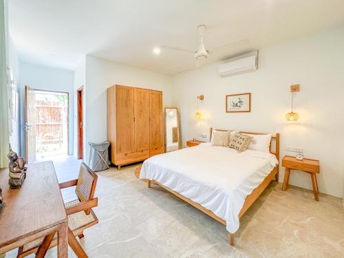 Ένα ή περισσότερα κρεβάτια σε δωμάτιο στο Stunning Boho Chic Beach Bungalow