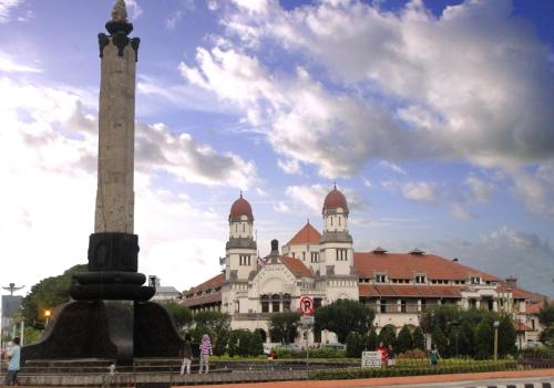 a large building with a monument in front of it at Gatsu Residence by Yurooms in Kalibanteng-kidul