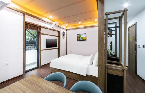 Postel nebo postele na pokoji v ubytování A25 Hotel - 21 Nghia Tan